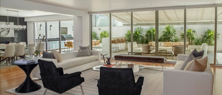 large living space with chairs and plants